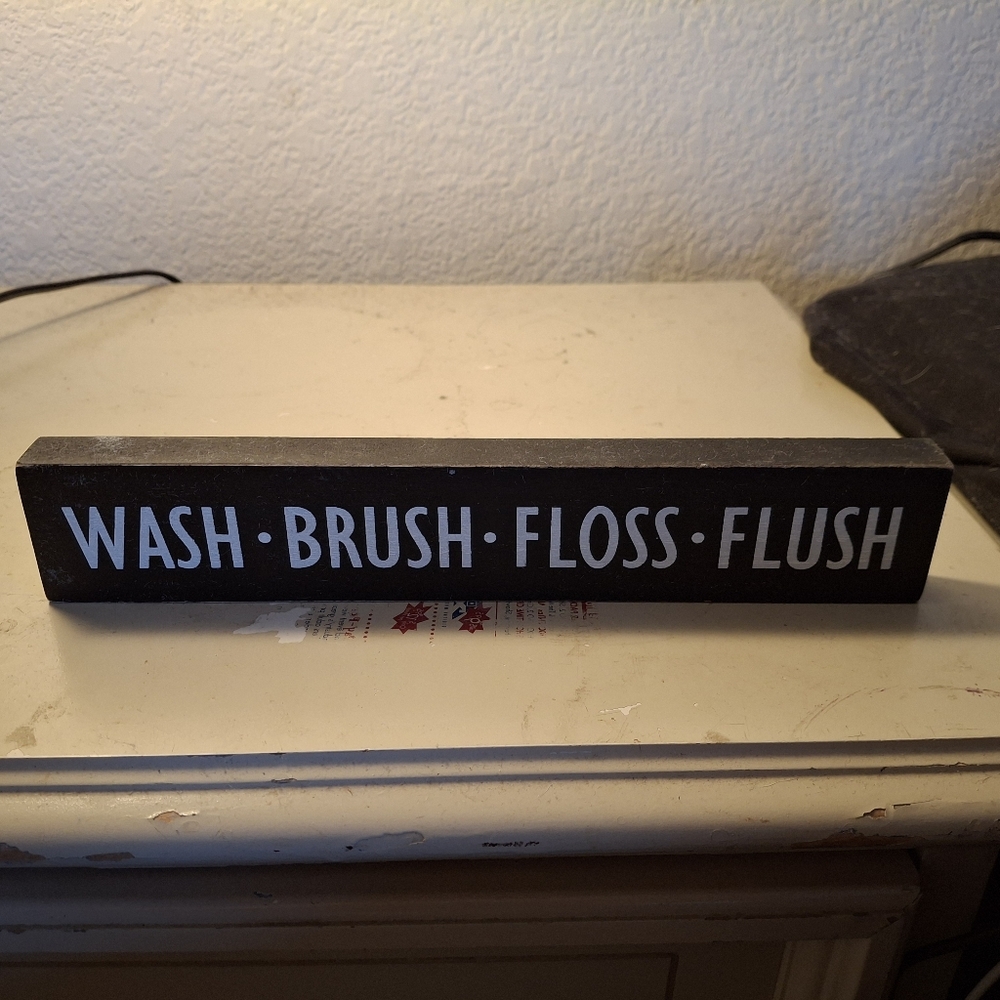Black Bathroom Sign with White Text
